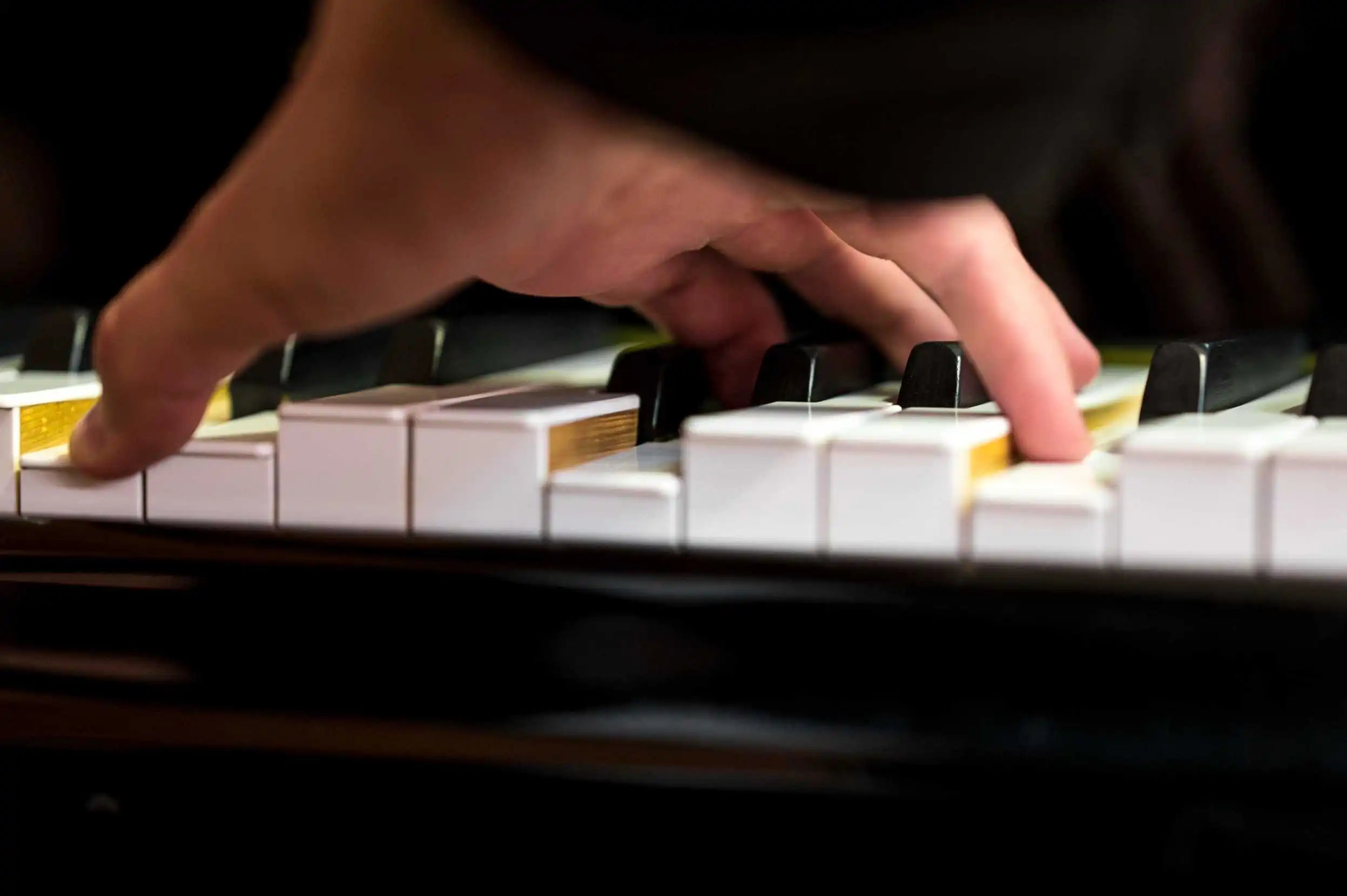 close-up-hand-holding-chord-piano